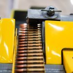 Ammunition being fed into the delinking and sorting process.